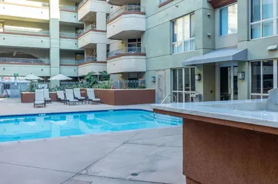 a swimming pool in front of a apartment building at San Diego's Diamond in San Diego