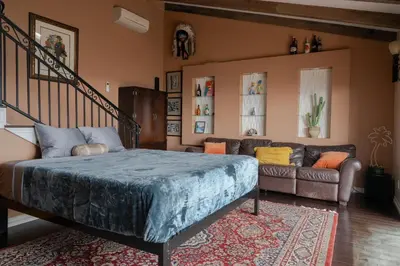 a bedroom with a bed and a couch at Stunning Home & Spectacular View in La Mesa