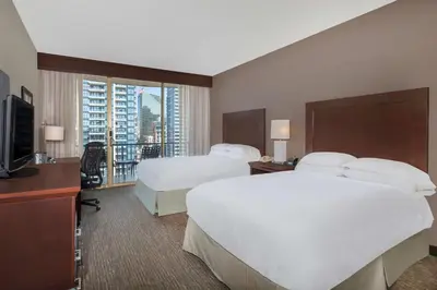 a hotel room with two beds and a television at Wyndham San Diego Bayside in San Diego