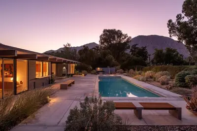 a home with a swimming pool and a house at The Milky Way Modern Desert Retreat in Borrego Springs