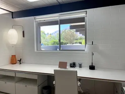 a room with a desk with a window and a chair at The Milky Way Modern Desert Retreat in Borrego Springs