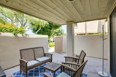a patio with two chairs and a table at Solana Beach Condo with Community Pool, Beach Access in Solana Beach