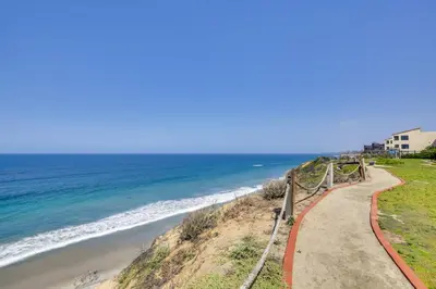 a path leading down to the beach at Solana Beach Condo with Community Pool, Beach Access in Solana Beach