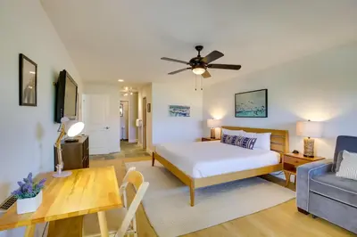 a bedroom with a bed and a living room at Solana Beach Condo with Community Pool, Beach Access in Solana Beach