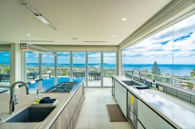 a large kitchen with a view of the ocean at La Jolla Paradise with Ocean Views Pool and Spa in San Diego