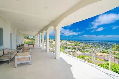 a balcony with couches and a view of the city at La Jolla Paradise with Ocean Views Pool and Spa in San Diego