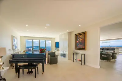 a living room with a pool table in the middle at La Jolla Paradise with Ocean Views Pool and Spa in San Diego