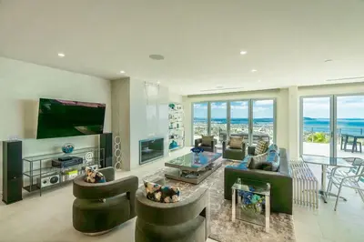 a large living room with a view of the ocean at La Jolla Paradise with Ocean Views Pool and Spa in San Diego
