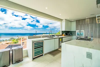 a large kitchen with a view of the ocean at La Jolla Paradise with Ocean Views Pool and Spa in San Diego