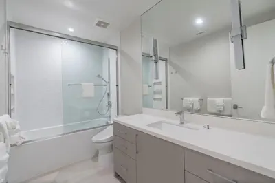 a bathroom with a sink and a toilet and a shower at La Jolla Paradise with Ocean Views Pool and Spa in San Diego
