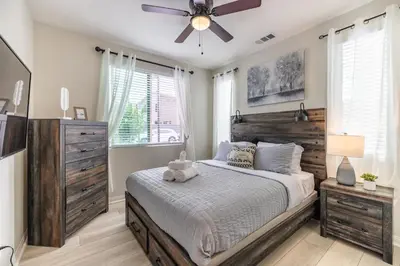 a bedroom with a bed and a ceiling fan at #Marbella Lane - Elegant 5BR Home Rancho Mission in Ladera Ranch