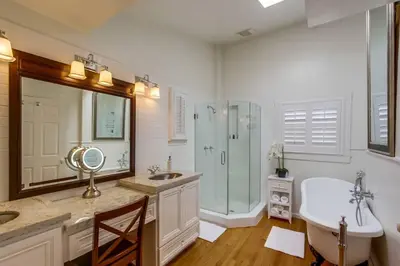 a bathroom with a tub and a sink and a shower at Cozy Craftsman Bungalow, Hillcrest/Mission Hills in San Diego