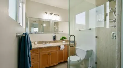 a bathroom with a toilet and a sink and a shower at Home Ensuite with Panoramic City View in San Diego