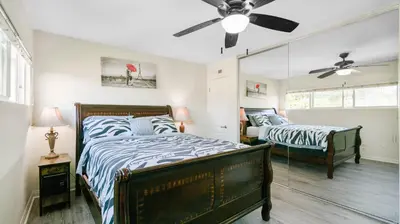 a bedroom with two beds and a ceiling fan at Home Ensuite with Panoramic City View in San Diego