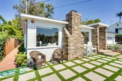 a backyard with two chairs and a house at Laguna Beach Escape with Hot Tub and Ocean Views! in Laguna Beach