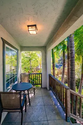 a patio with a table and chairs on a balcony at North Park Sanctuary in San Diego