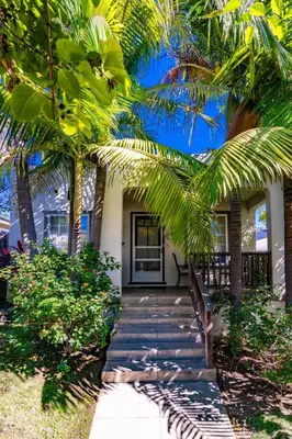 a house with palm trees in front of it at North Park Sanctuary in San Diego