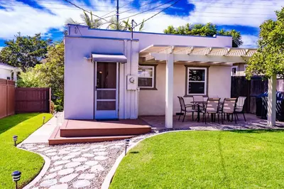 a purple house with a table and chairs in a yard at North Park Sanctuary in San Diego
