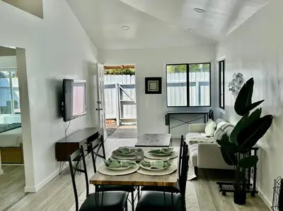 a living room with a table and a couch at Beachside 2BR close 2 sand, town in Laguna Beach
