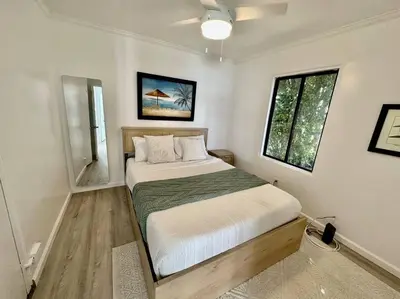 a bedroom with a bed and a window at Beachside 2BR close 2 sand, town in Laguna Beach