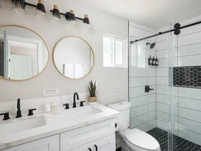 a bathroom with a toilet and a sink and a shower at Peaceful 4br with Fire Pit and Huge Yard in San Diego