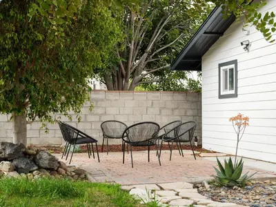 a group of chairs and a table in a yard at Peaceful 4br with Fire Pit and Huge Yard in San Diego