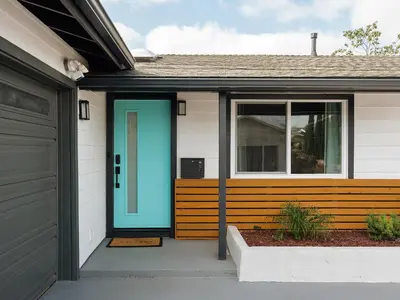 a front door of a house with a blue door at Peaceful 4br with Fire Pit and Huge Yard in San Diego