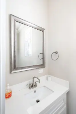 a white bathroom with a sink and a mirror at 4048 Stylish condo in Hillcrest Mission Hills in San Diego