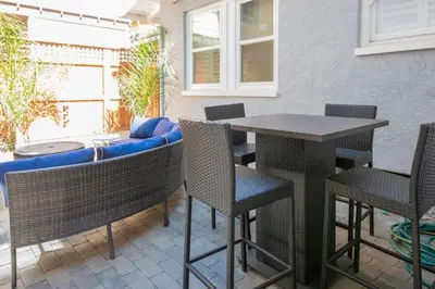 a patio with a table and chairs and a couch at 4048 Stylish condo in Hillcrest Mission Hills in San Diego
