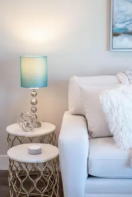 a lamp on a side table next to a couch at 4048 Stylish condo in Hillcrest Mission Hills in San Diego