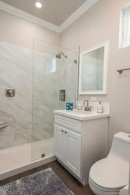 a bathroom with a shower and a toilet and a sink at 4046 Modern condo in Hillcrest Mission Hills in San Diego