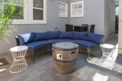 a blue couch and two chairs and a table at 4046 Modern condo in Hillcrest Mission Hills in San Diego