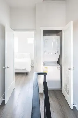 a white kitchen with a sink and a stove at 4046 Modern condo in Hillcrest Mission Hills in San Diego