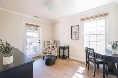 a living room with a dining room table and chairs at 4221 Urban oasis in Hillcrest Mission Hills in San Diego