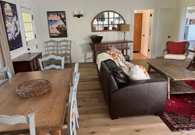 a living room with a couch and a table at laguna beach cottage home in Laguna Beach