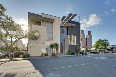 a building on the corner of a street at Rooftop with Views Modern Little Italy Townhome in San Diego