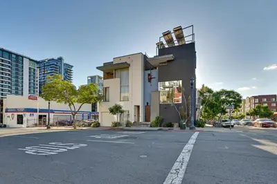 an empty street in a city with a building at Rooftop with Views Modern Little Italy Townhome in San Diego