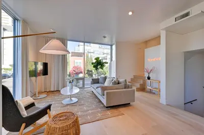 a living room with a couch and a chair at Rooftop with Views Modern Little Italy Townhome in San Diego