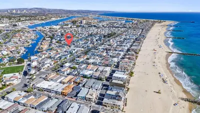 an aerial view of a beach with a red marker at Magical Bayfront Home w Epic Dock on Peninsula in Newport Beach