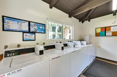 a row of white machines in a room at San Diego Condo Pool Access, 8 Mi to Downtown in San Diego