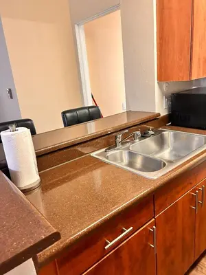 a kitchen with a sink and a counter top at Luxurious stay near the beach in Newport Beach