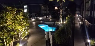 a swimming pool at night with lights at Luxurious stay near the beach in Newport Beach