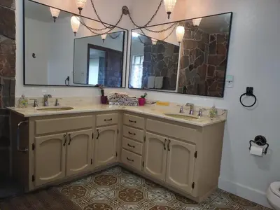 a bathroom with two sinks and a large mirror at Custom Home - Beach close/convenient to everything in Oceanside