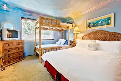 a bedroom with a bed and a bunk bed at WesternWhiteHouseSC in San Clemente
