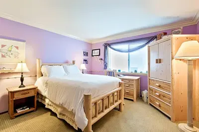 a bedroom with a large bed and a window at WesternWhiteHouseSC in San Clemente