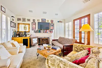 a living room with two couches and a fireplace at WesternWhiteHouseSC in San Clemente