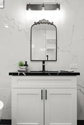 a bathroom with a sink and a mirror at Safari Vines Retreat in Escondido