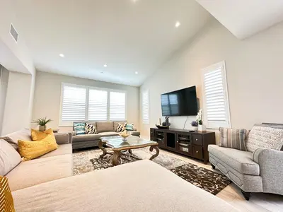 a living room with two couches and a tv at Close to UCI 4b&4b villa Irvine eastwood in Irvine