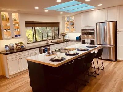 a large kitchen with a large island in the middle at Quiet Retreat With Pool And Hot Tub in Escondido