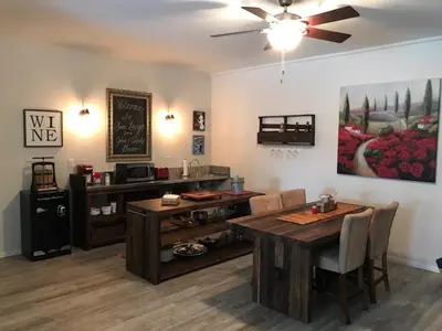 a living room with a dining room table and a ceiling fan at Quiet Retreat With Pool And Hot Tub in Escondido